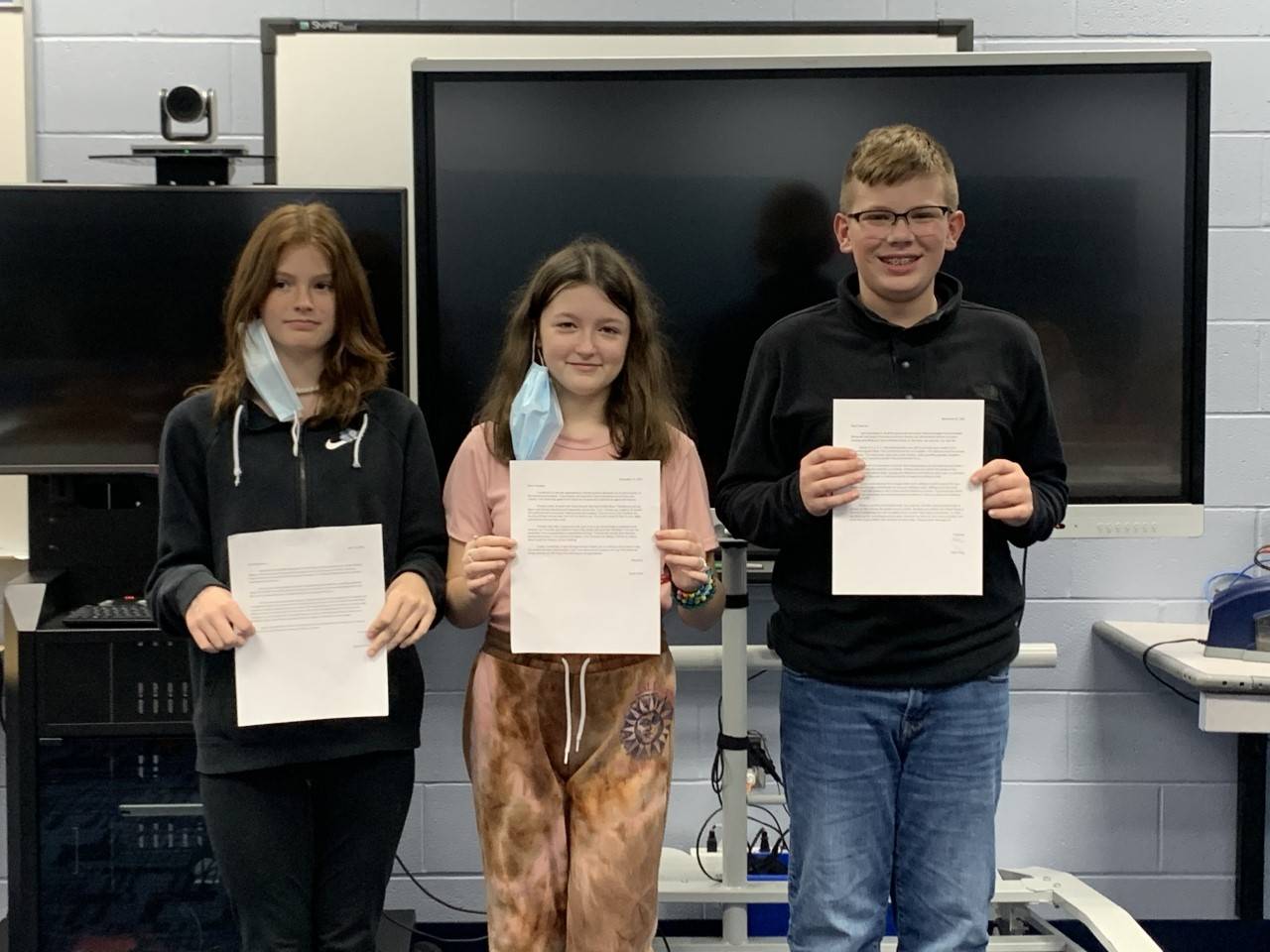 3 Students with their letters.
