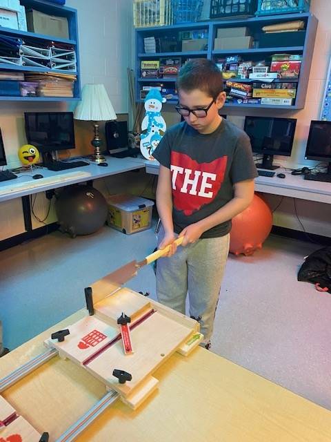 Students practicing woodshop