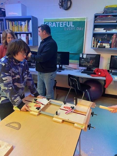Students practicing woodshop